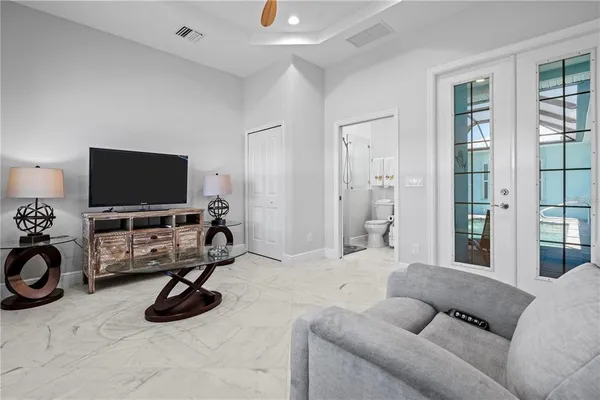 a bathroom with a granite countertop toilet sink and mirror
