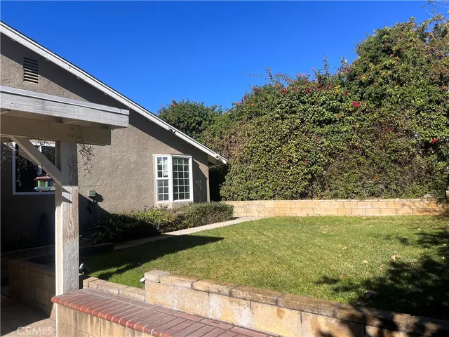 a backyard of a house with lots of green space