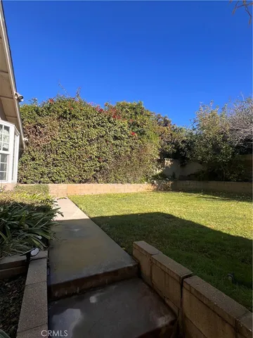 a view of a yard with an ocean view