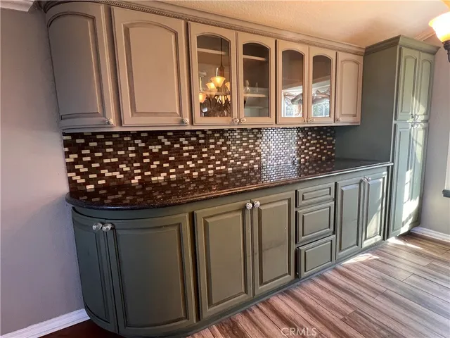a kitchen with stainless steel appliances granite countertop a sink and cabinets