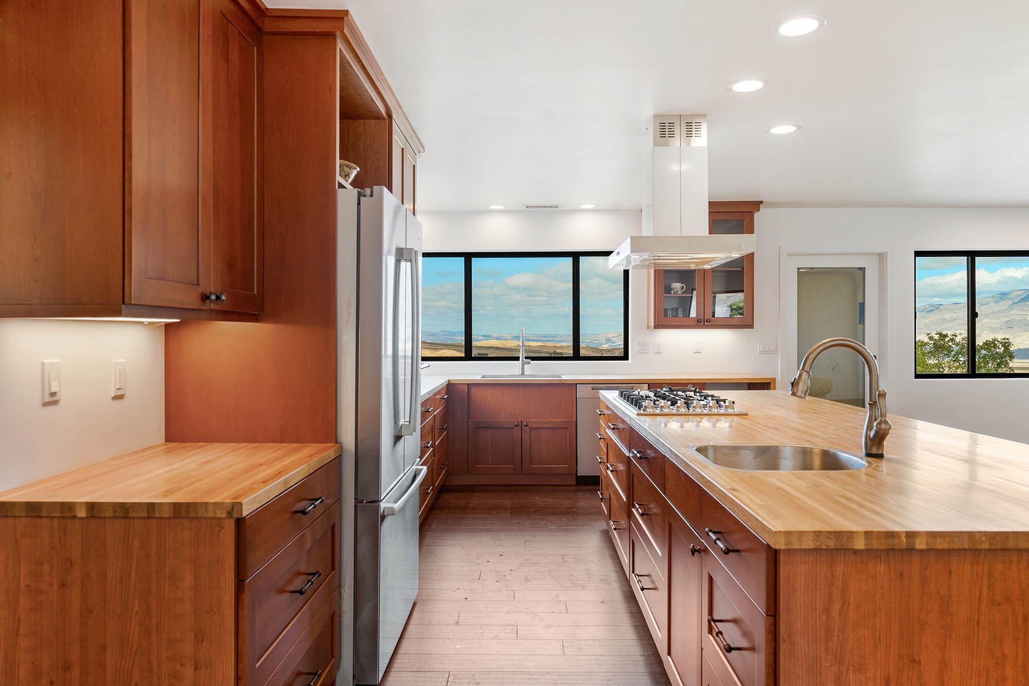 2170 Aliso Park Road New Cuyama, CA 93254 - Photo 29 of 71 a kitchen with a sink stove and cabinets