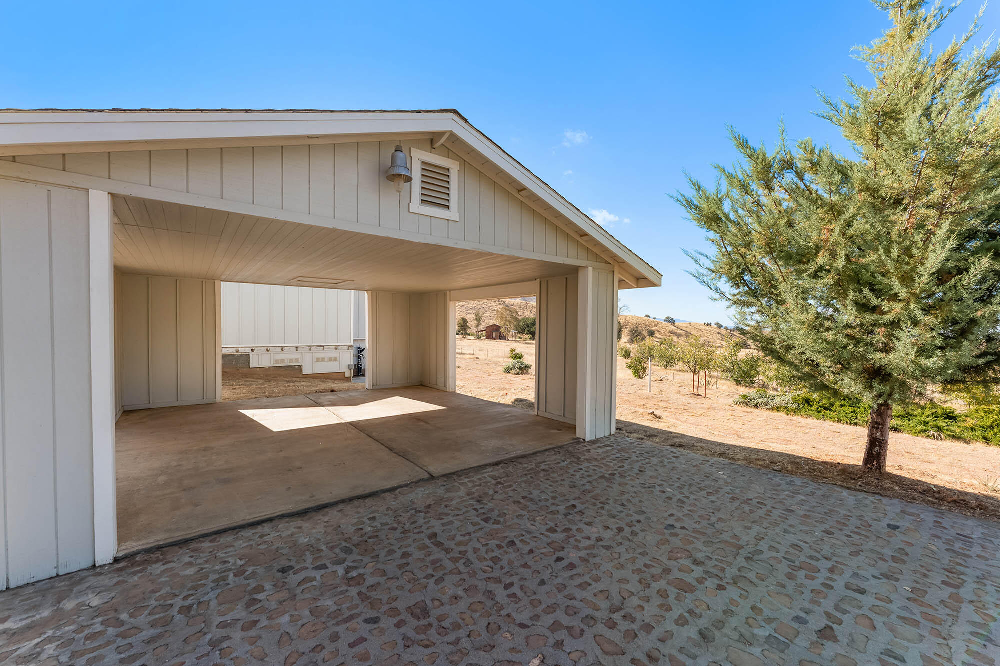 2170 Aliso Park Road New Cuyama, CA 93254 - Photo 39 of 71 a view of a house with a yard and garage