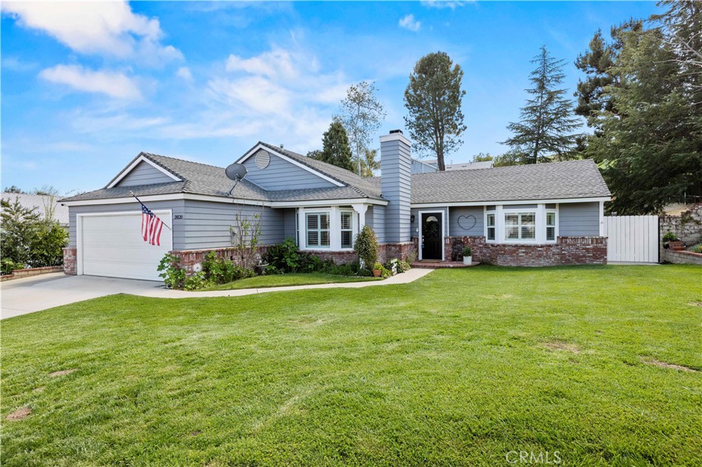 28120 Branch Road Castaic, CA 91384 - Photo 1 of 1 a front view of a house with a garden and porch
