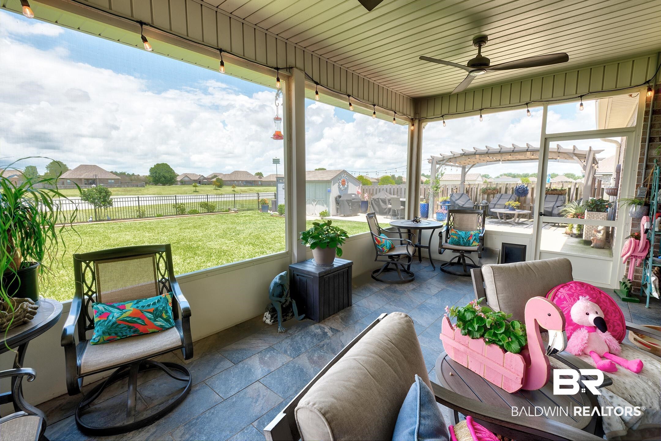 9988 Dunleith Loop Daphne, AL 36526 - Photo 24 of 51 Sunroom / solarium featuring ceiling fans, a wealth of natural light, and insulated ceiling. Additional plug outlets, 2 doors and tiled floors