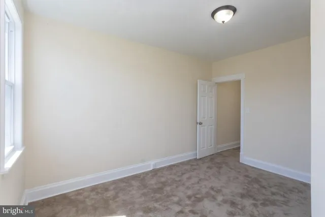 an empty room with windows