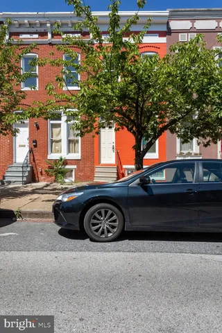 a front view of a house with parking area