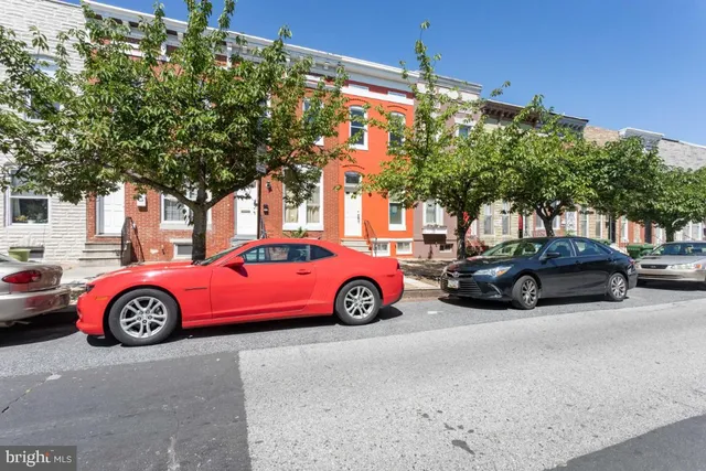 a view of a car in front of a house