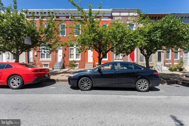 a car parked in front of a house