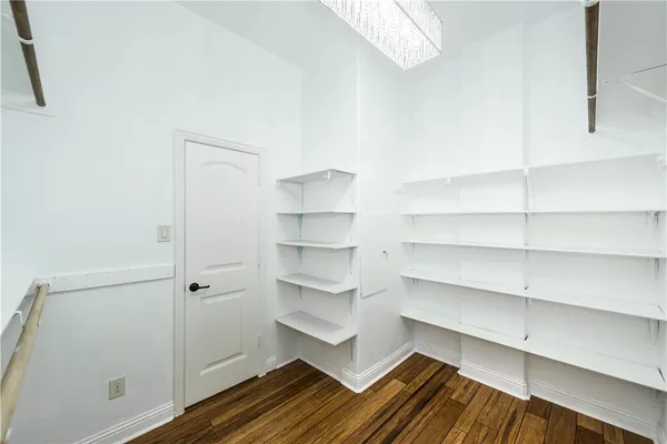 a bathroom with a toilet and bathtub