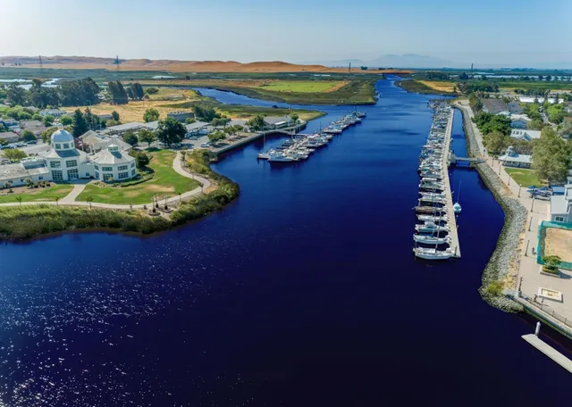 a view of a dining room with furniture and a floor to ceiling window