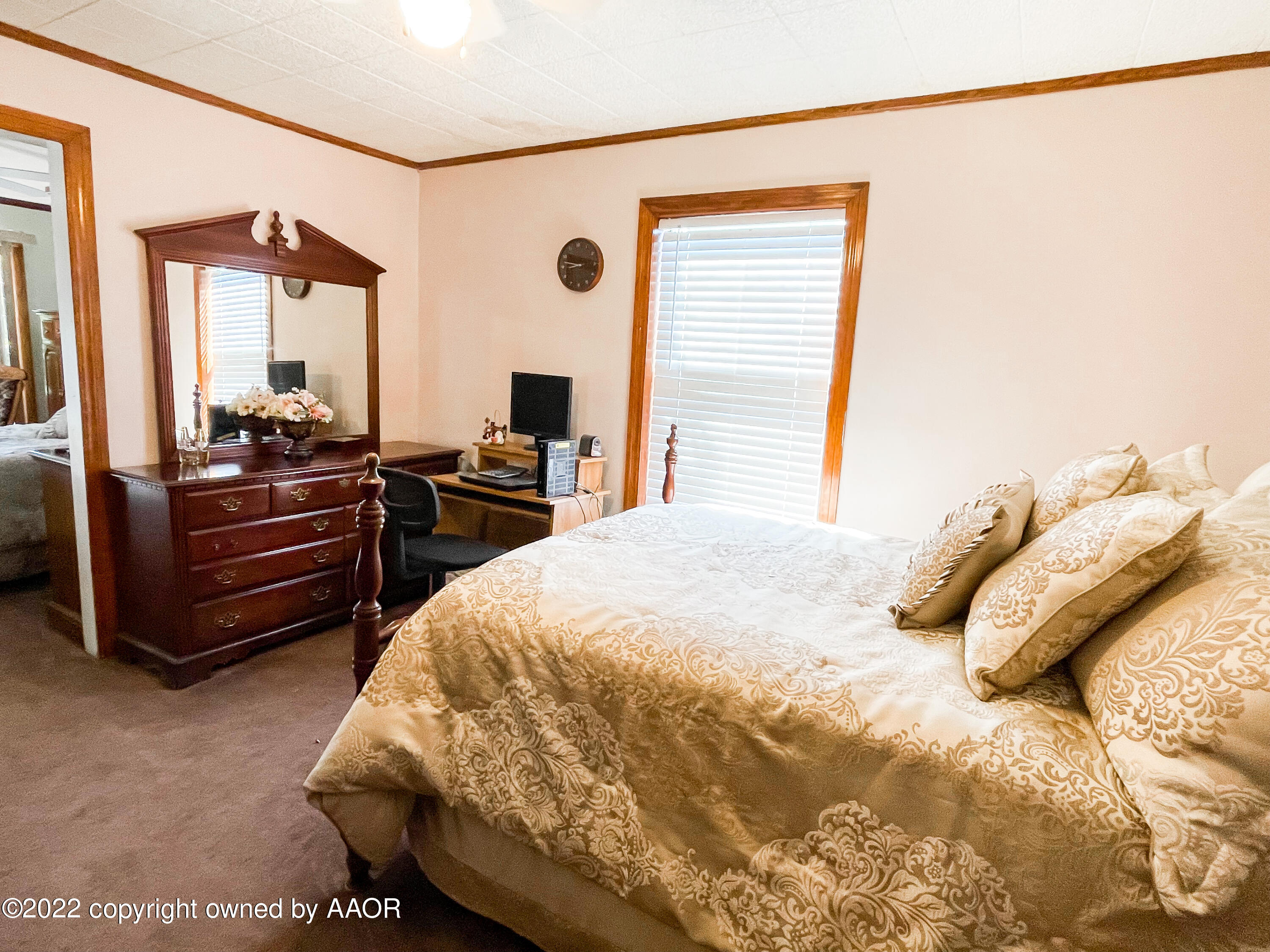 1314 Coble Drive Borger, TX 79007 - Photo 15 of 16 a bedroom with a bed and a flat tv screen