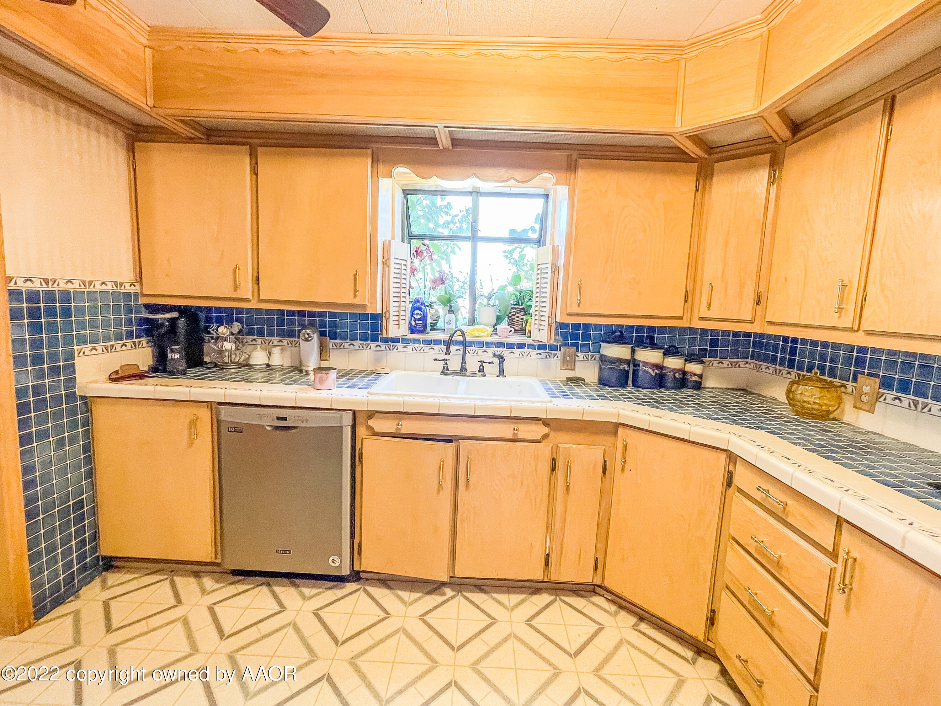 1314 Coble Drive Borger, TX 79007 - Photo 7 of 16 a kitchen with stainless steel appliances a sink and a window