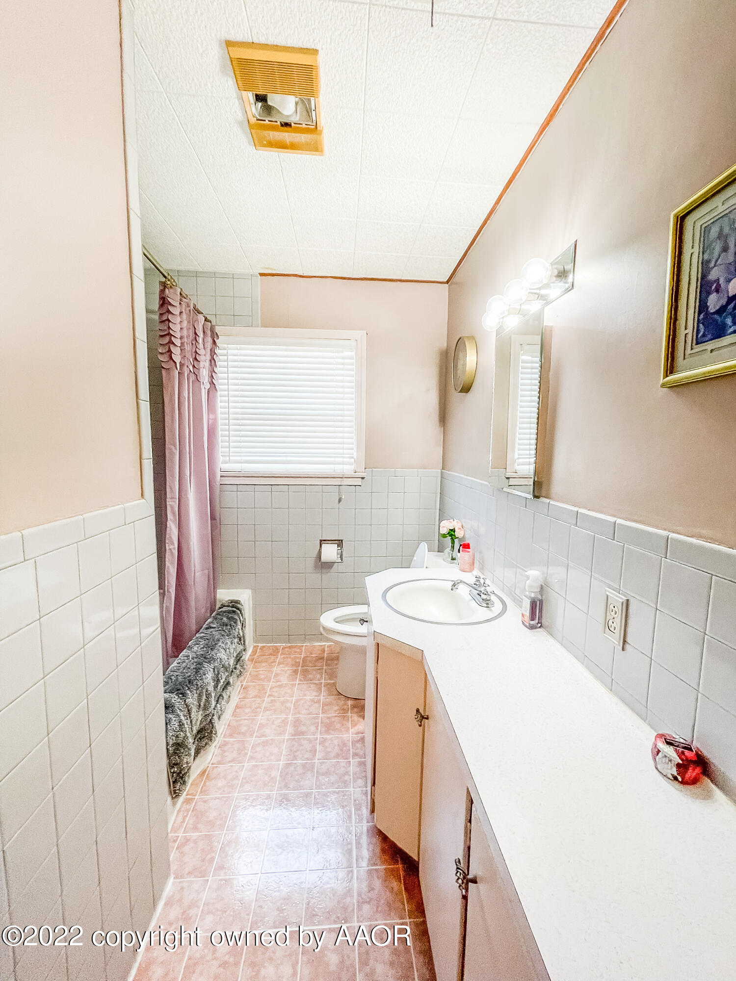 1314 Coble Drive Borger, TX 79007 - Photo 10 of 16 a bathroom with a sink a vanity and a mirror
