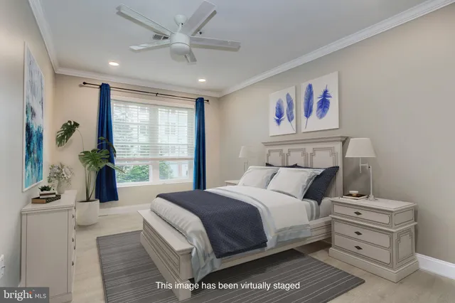 a bedroom with a large bed and a large window