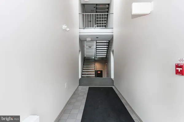 a view of a hallway with windows