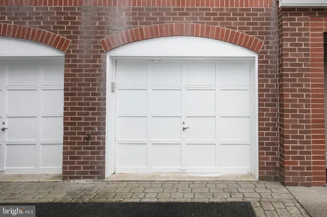 a white building with black door