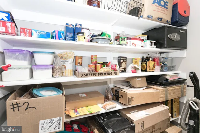 a kitchen with stainless steel appliances a stove a sink a microwave a refrigerator and cabinets