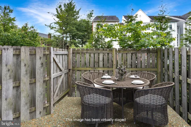 a view of a chairs and table in the patio