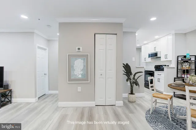 a view of a livingroom with furniture and a flat screen tv
