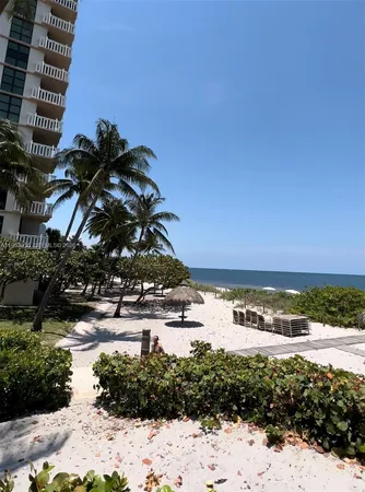 a view of a ocean with a building in the background