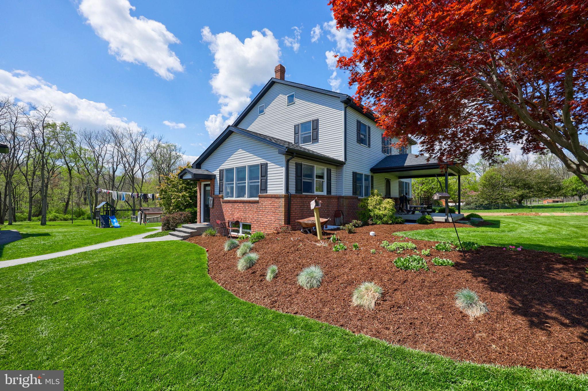 480 Jacobs Road Narvon, PA 17555 - Photo 11 of 90 a front view of a house with a yard table and seating