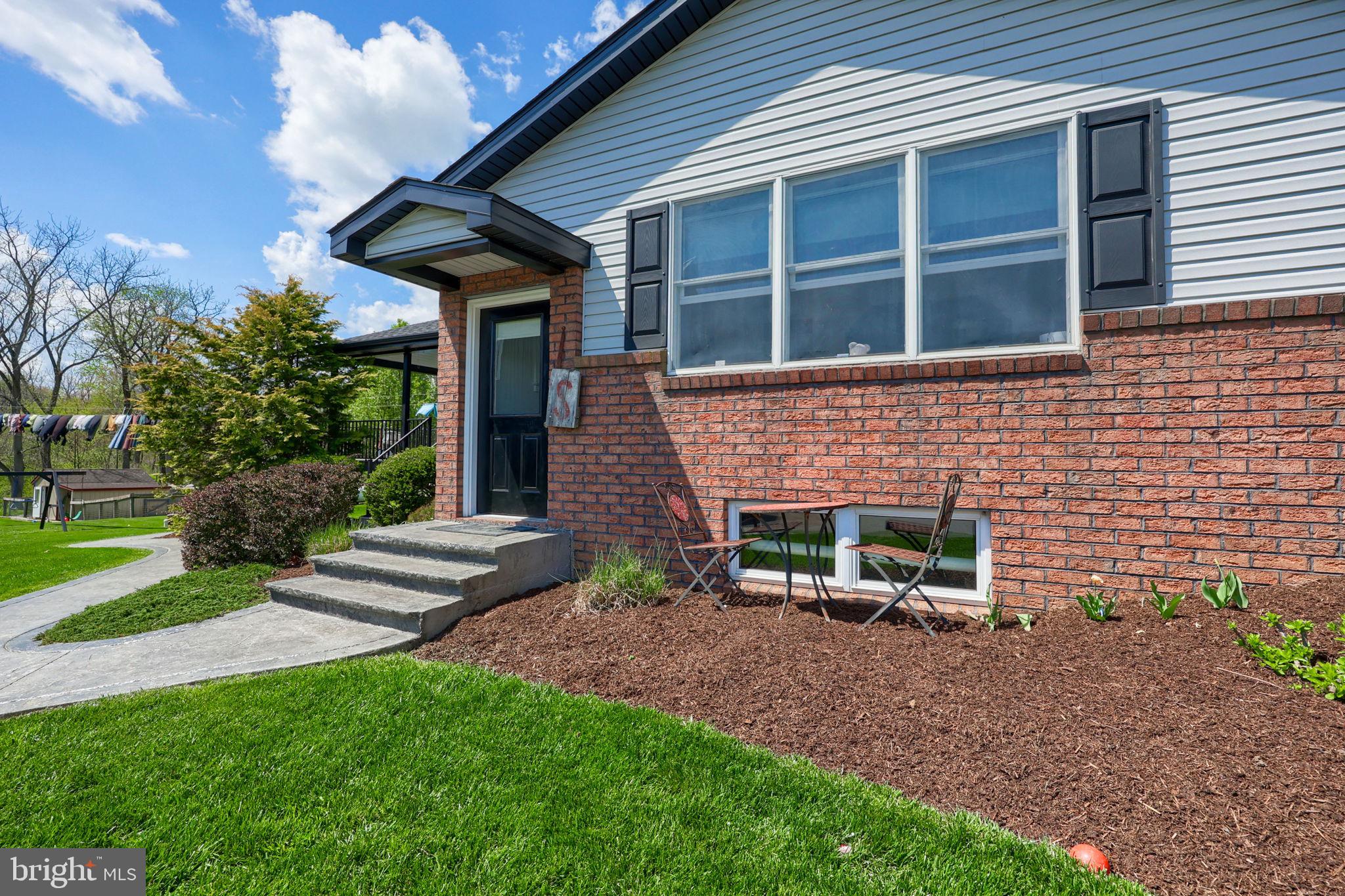 480 Jacobs Road Narvon, PA 17555 - Photo 13 of 90 Charming brick facade with lush greenery.
