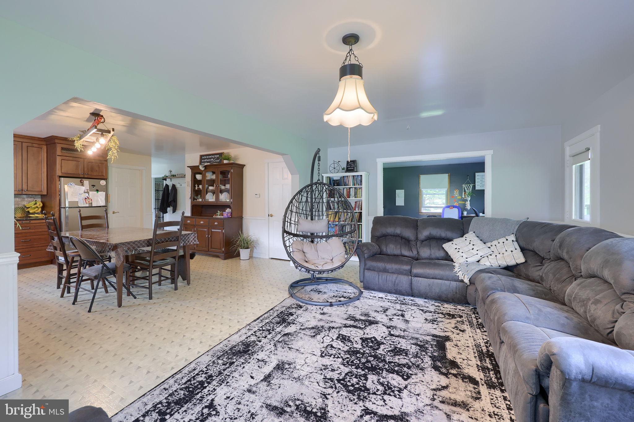 480 Jacobs Road Narvon, PA 17555 - Photo 28 of 90 a living room with furniture a chandelier and a dining table