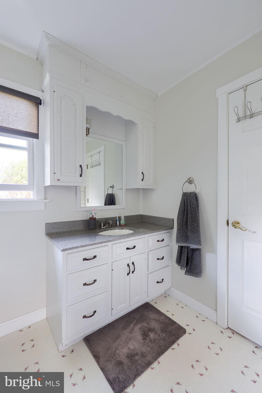 480 Jacobs Road Narvon, PA 17555 - Photo 36 of 90 a kitchen with granite countertop a sink a vanity and stainless steel appliances