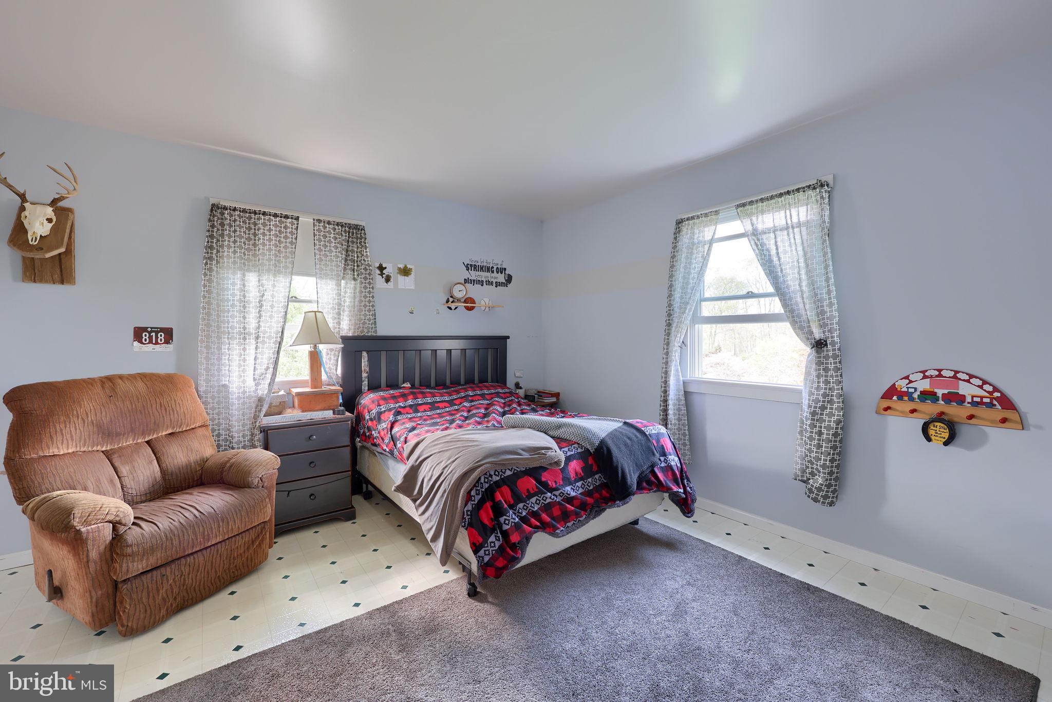 480 Jacobs Road Narvon, PA 17555 - Photo 41 of 90 a bedroom with a bed couch and a window