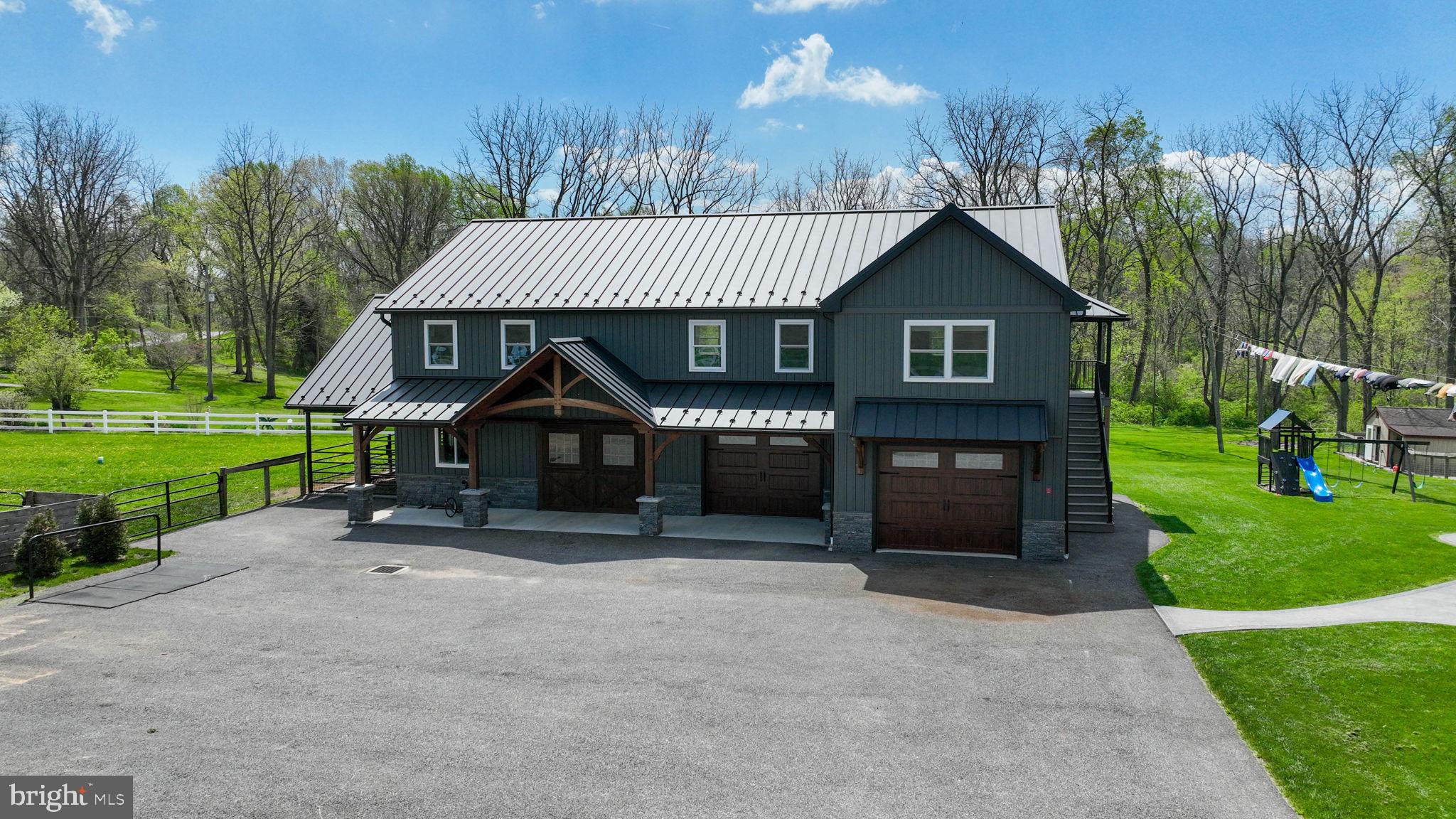 480 Jacobs Road Narvon, PA 17555 - Photo 60 of 90 a front view of a house with a yard and garage