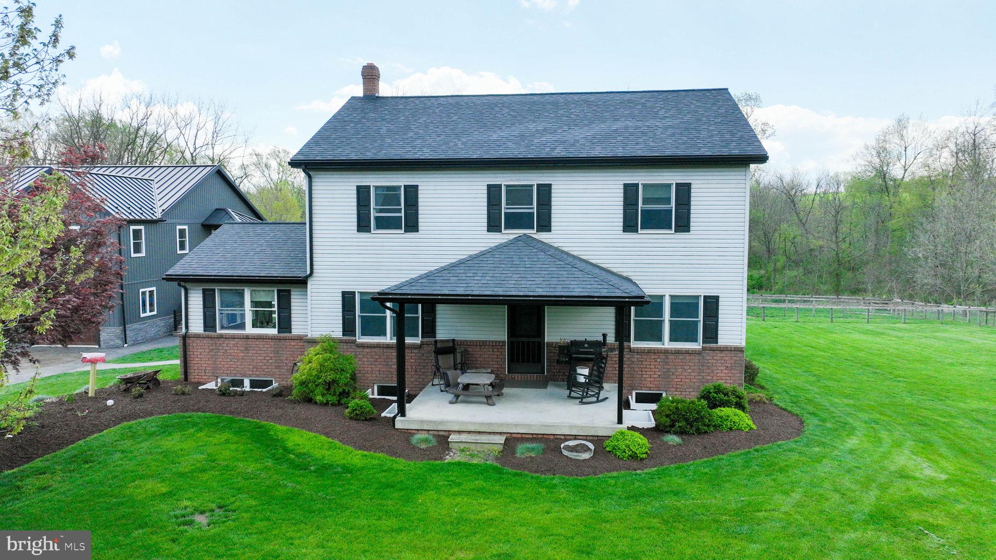 480 Jacobs Road Narvon, PA 17555 - Photo 6 of 90 a front view of a house with garden and yard