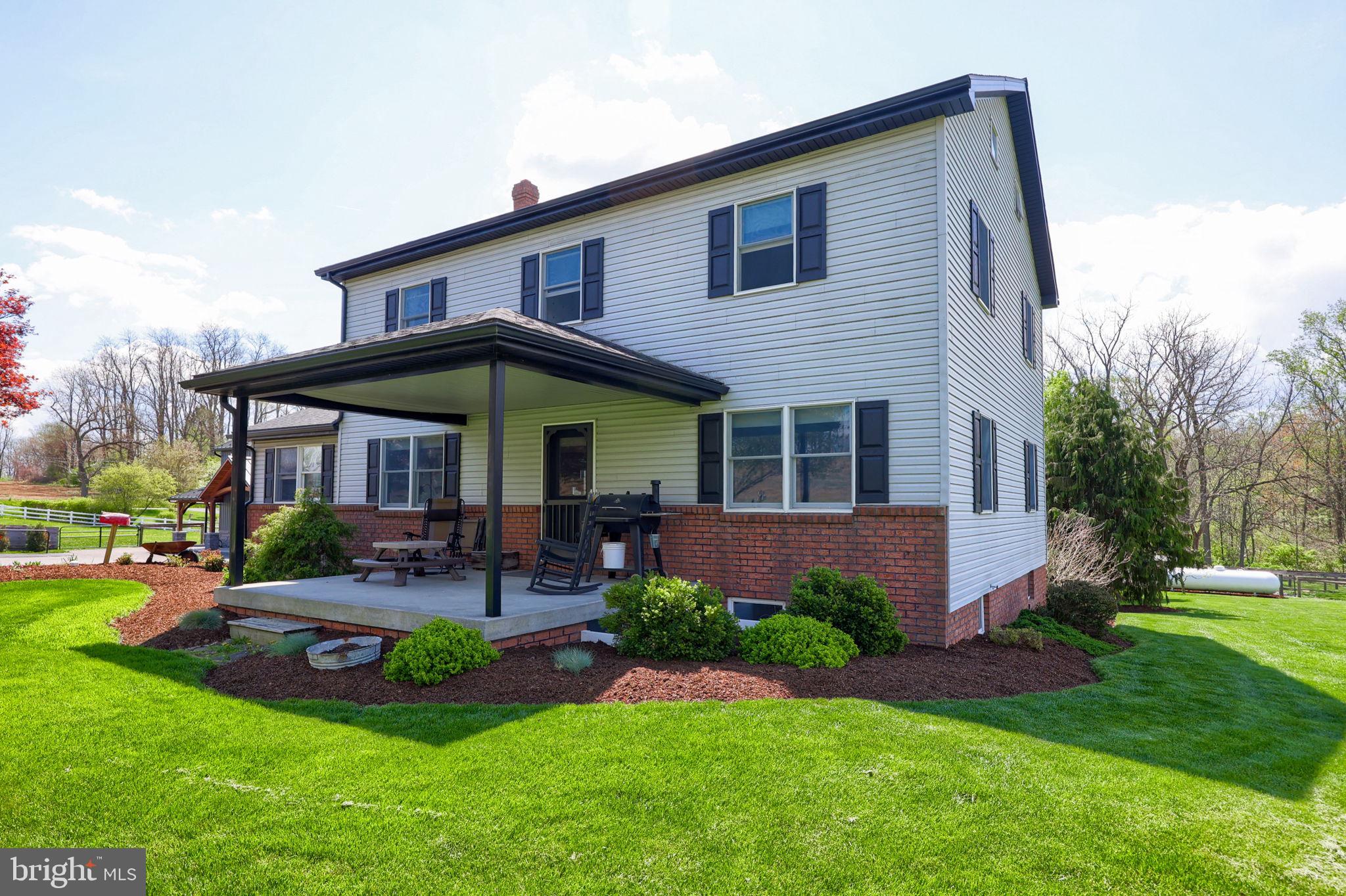 480 Jacobs Road Narvon, PA 17555 - Photo 9 of 90 a front view of a house with swimming pool and garden