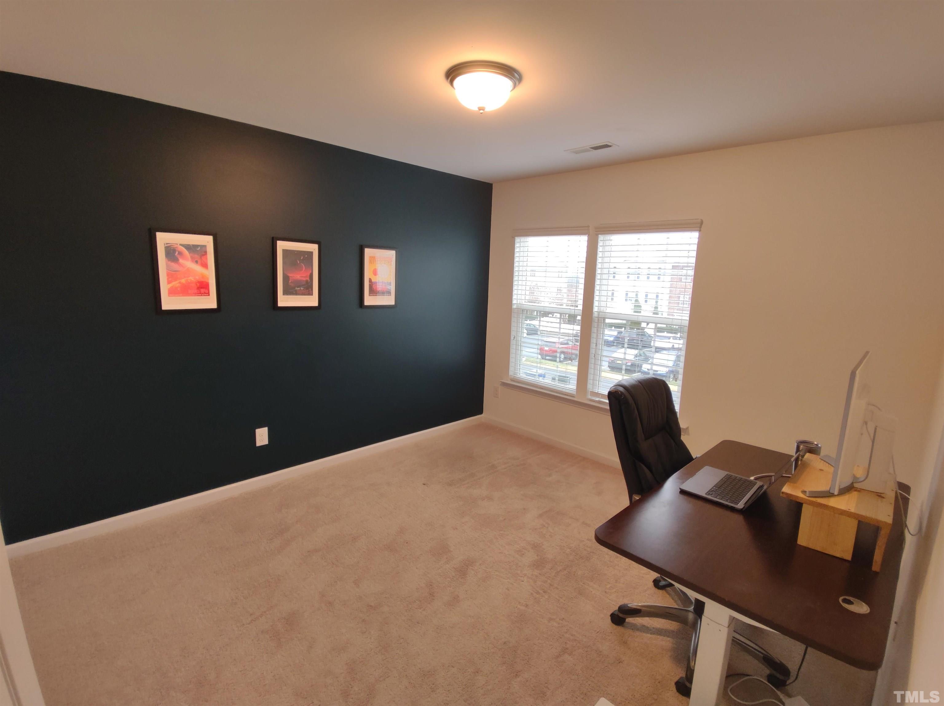 1125 Ileagnes Road Raleigh, NC 27603 - Photo 18 of 27 a bedroom with a bed and a window