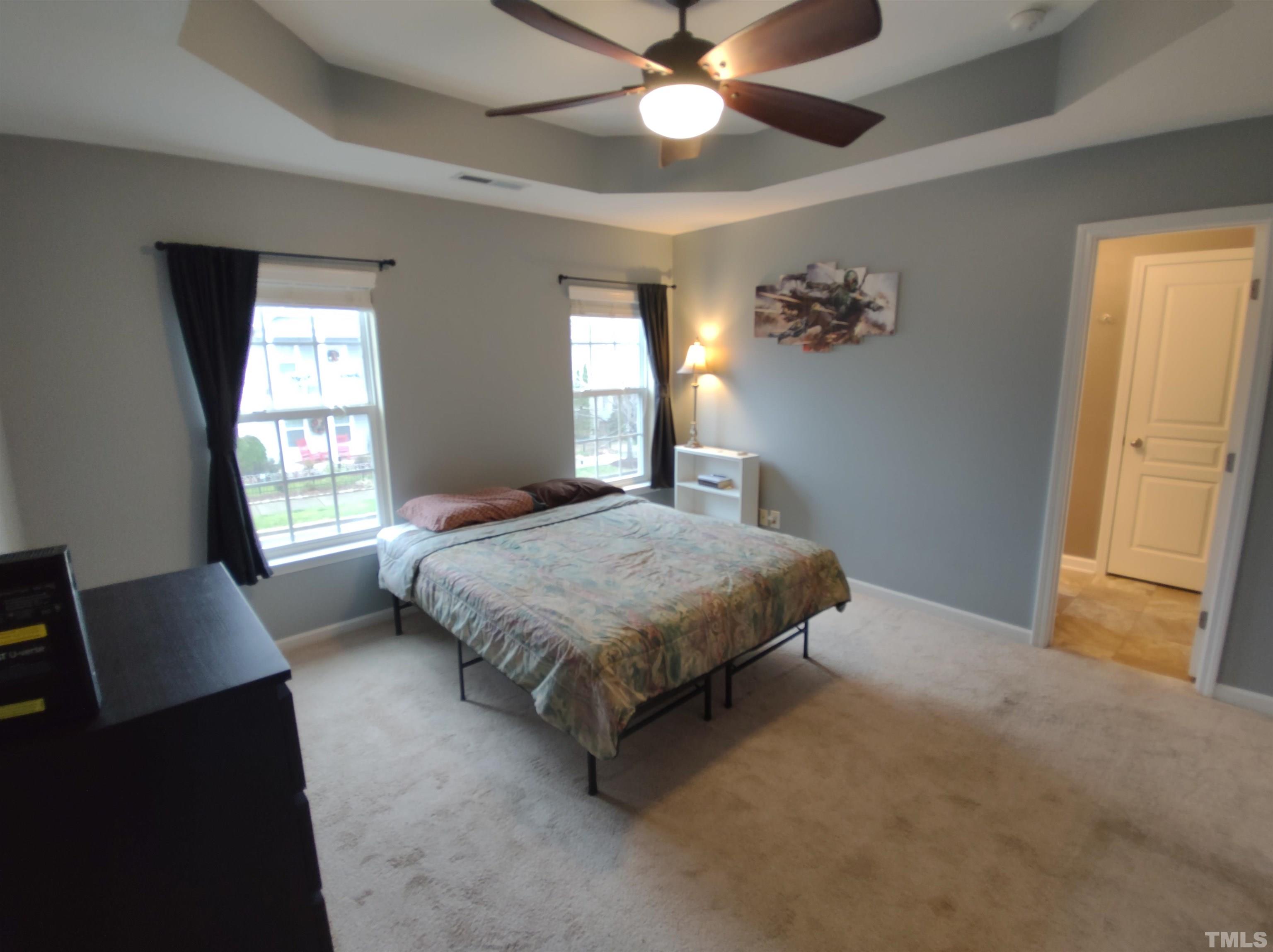 1125 Ileagnes Road Raleigh, NC 27603 - Photo 23 of 27 a spacious bedroom with a bed and a window