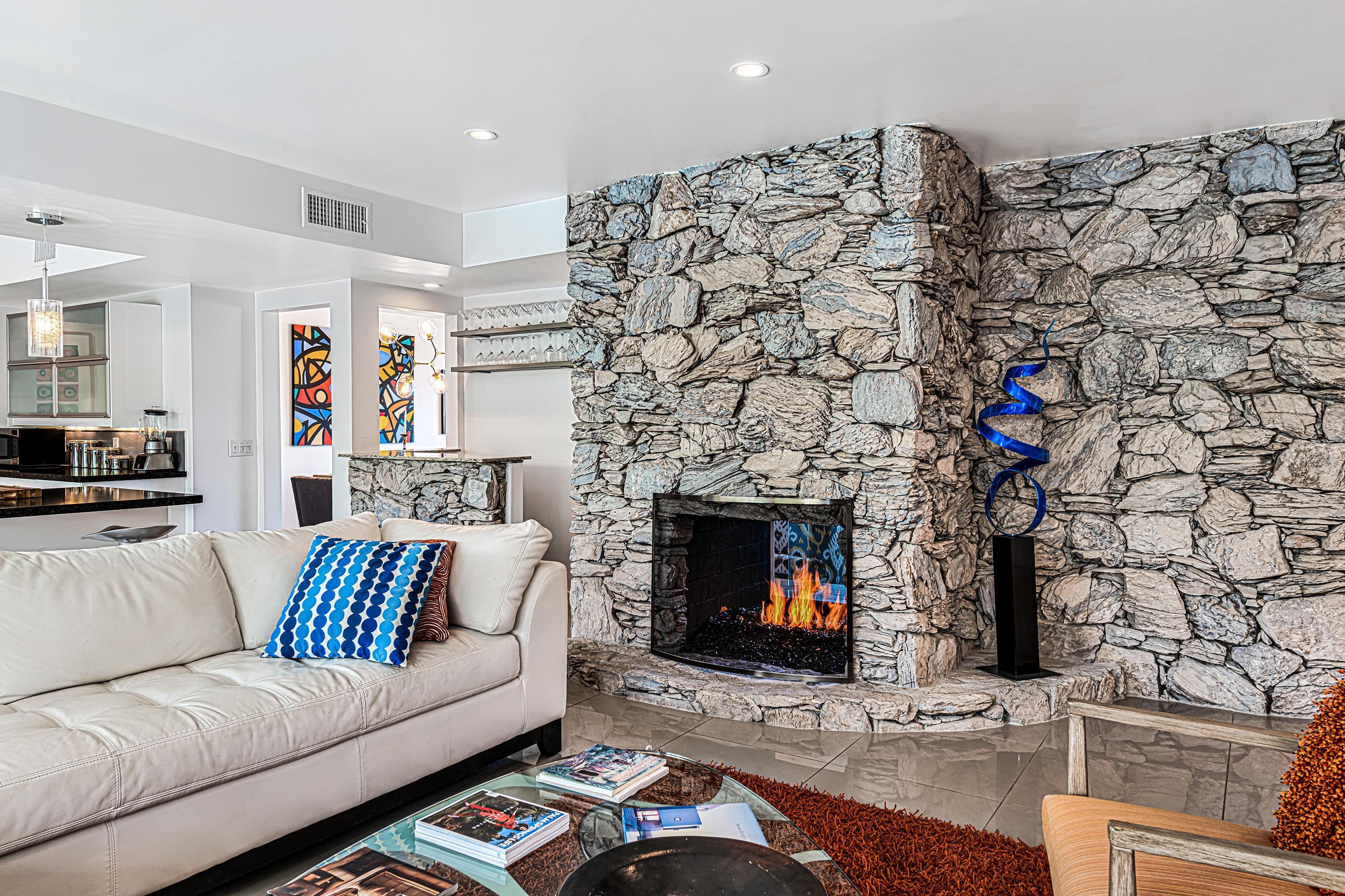 1130 East Deepwell Road Palm Springs, CA 92264 - Photo 12 of 55 a living room with furniture and a fireplace