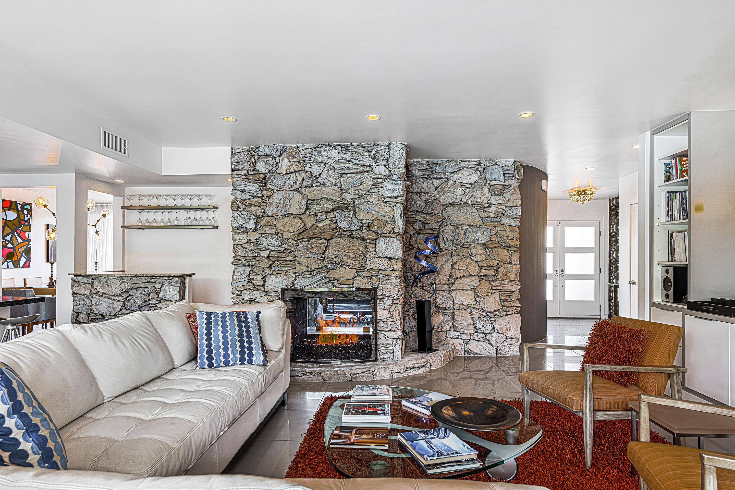 1130 East Deepwell Road Palm Springs, CA 92264 - Photo 13 of 55 a living room with furniture and a fireplace