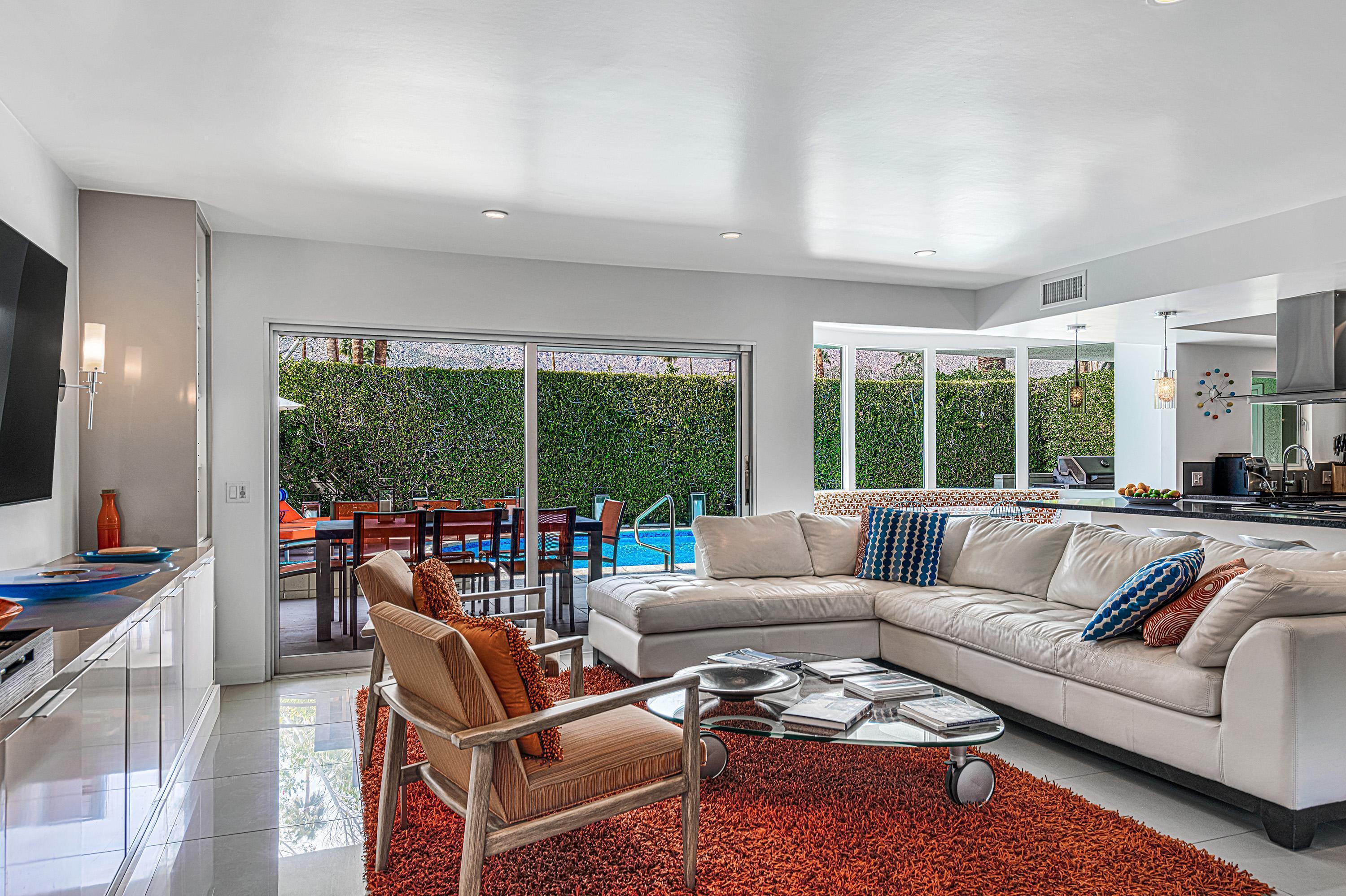 1130 East Deepwell Road Palm Springs, CA 92264 - Photo 14 of 55 a living room with furniture and a large window