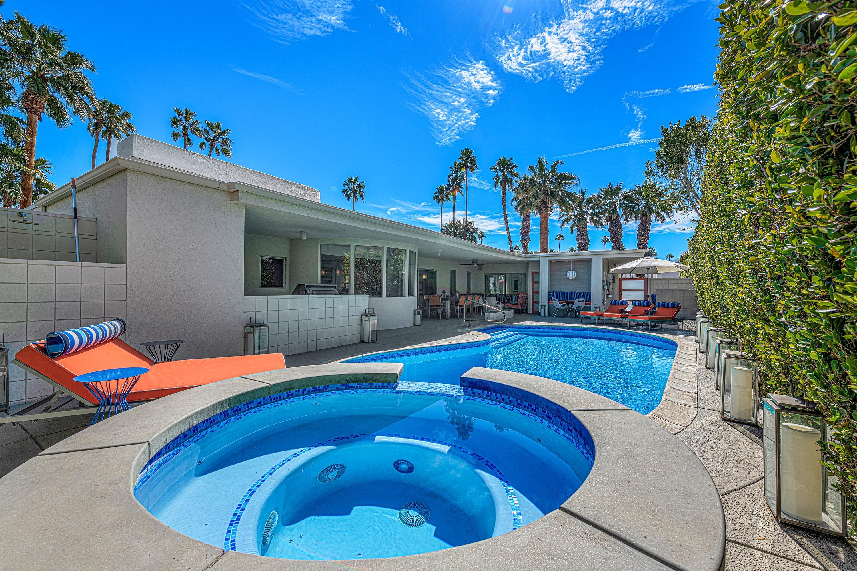 1130 East Deepwell Road Palm Springs, CA 92264 - Photo 19 of 55 a view of a house with swimming pool
