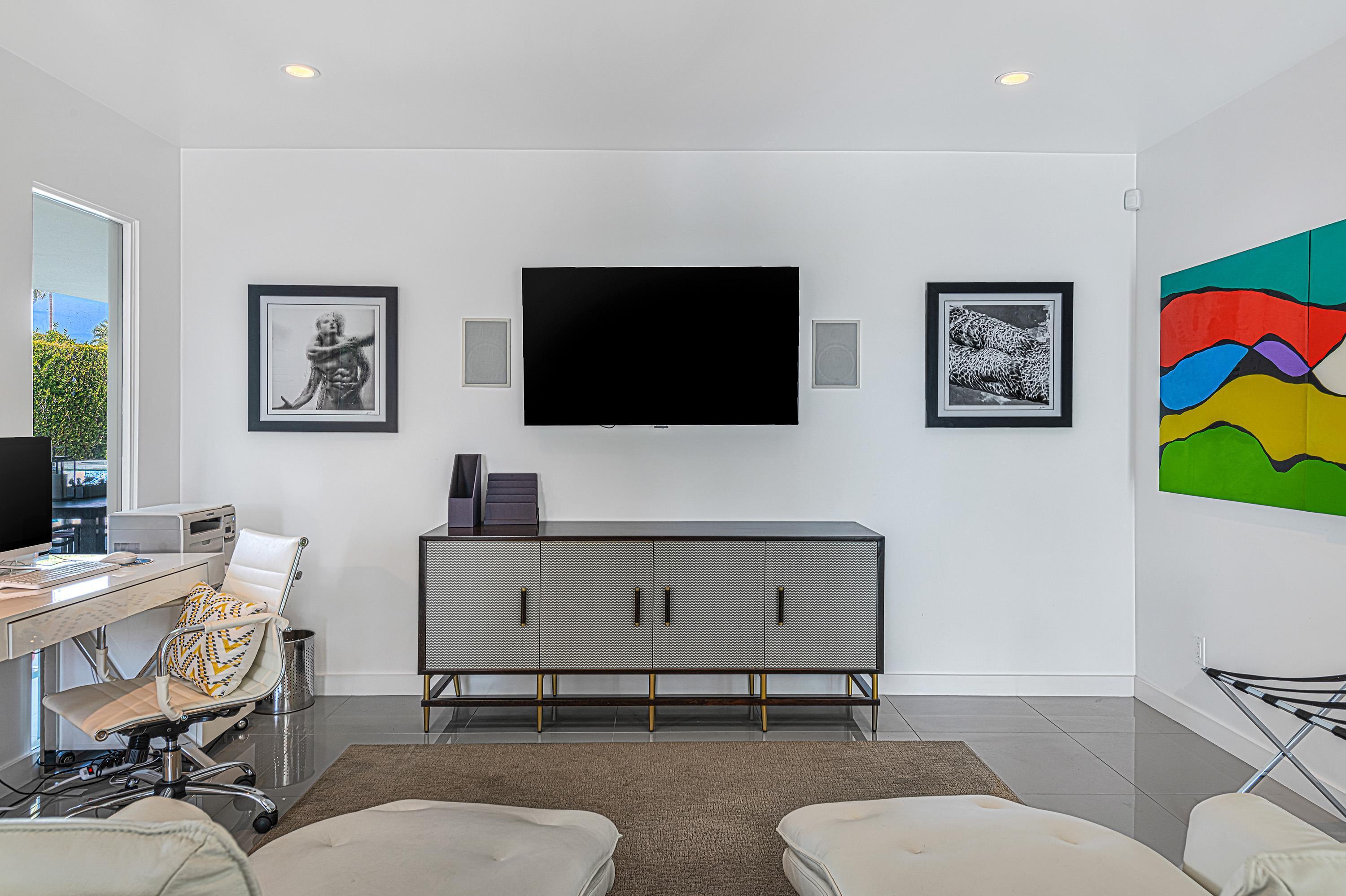 1130 East Deepwell Road Palm Springs, CA 92264 - Photo 22 of 55 a living room with furniture and a flat screen tv