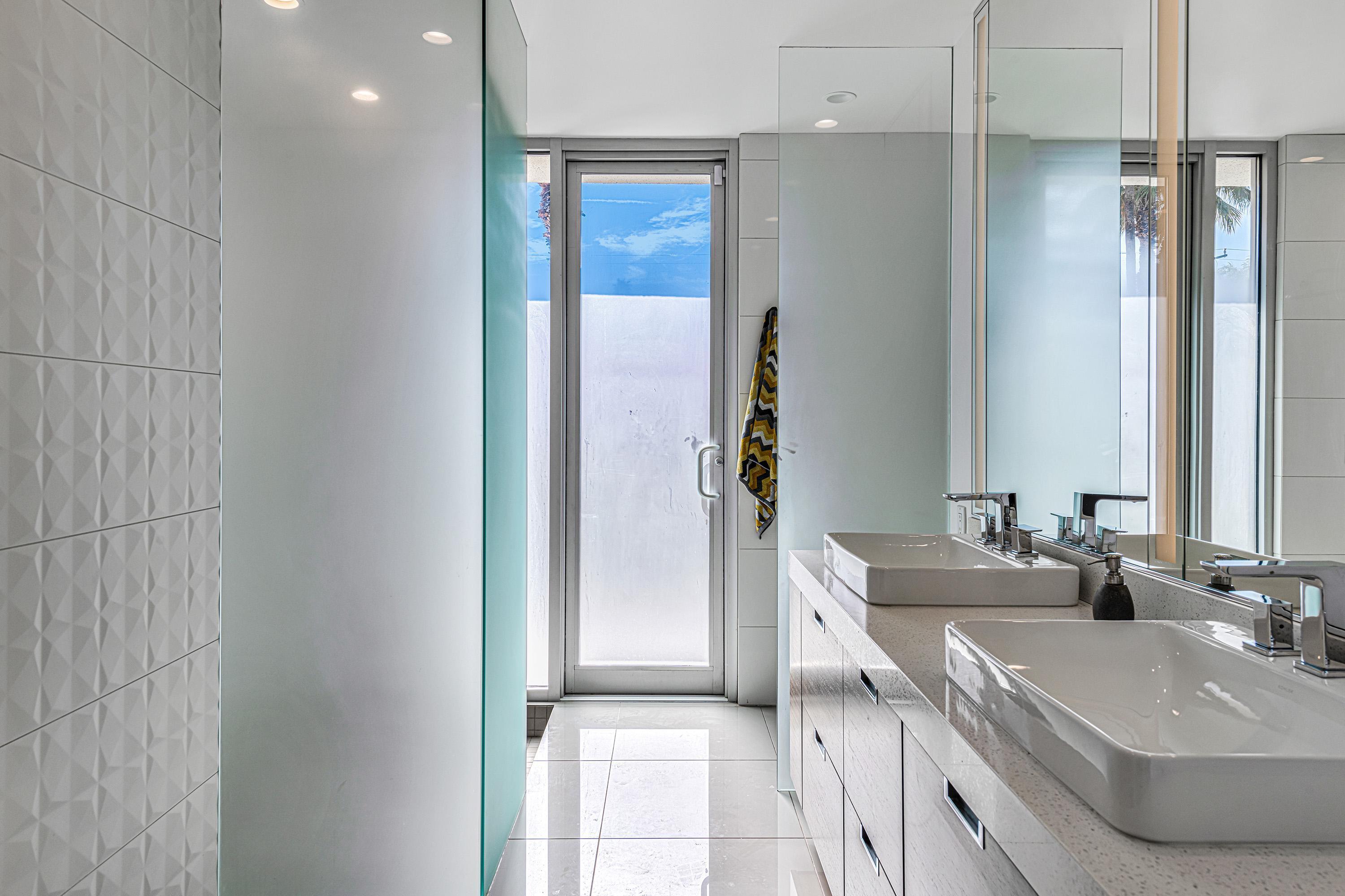 1130 East Deepwell Road Palm Springs, CA 92264 - Photo 24 of 55 a bathroom with a sink and a mirror