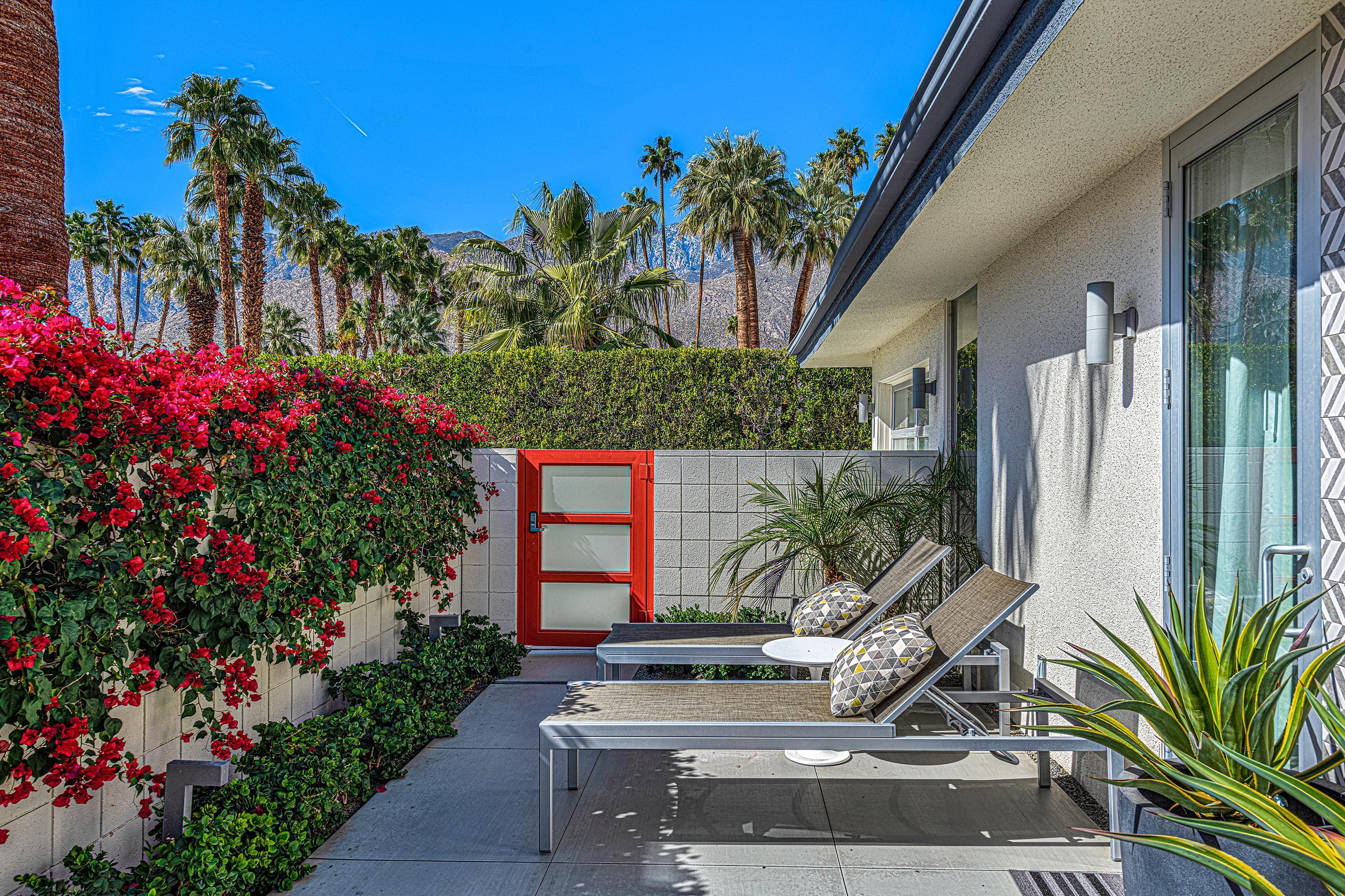 1130 East Deepwell Road Palm Springs, CA 92264 - Photo 25 of 55 a view of a bench in front of house