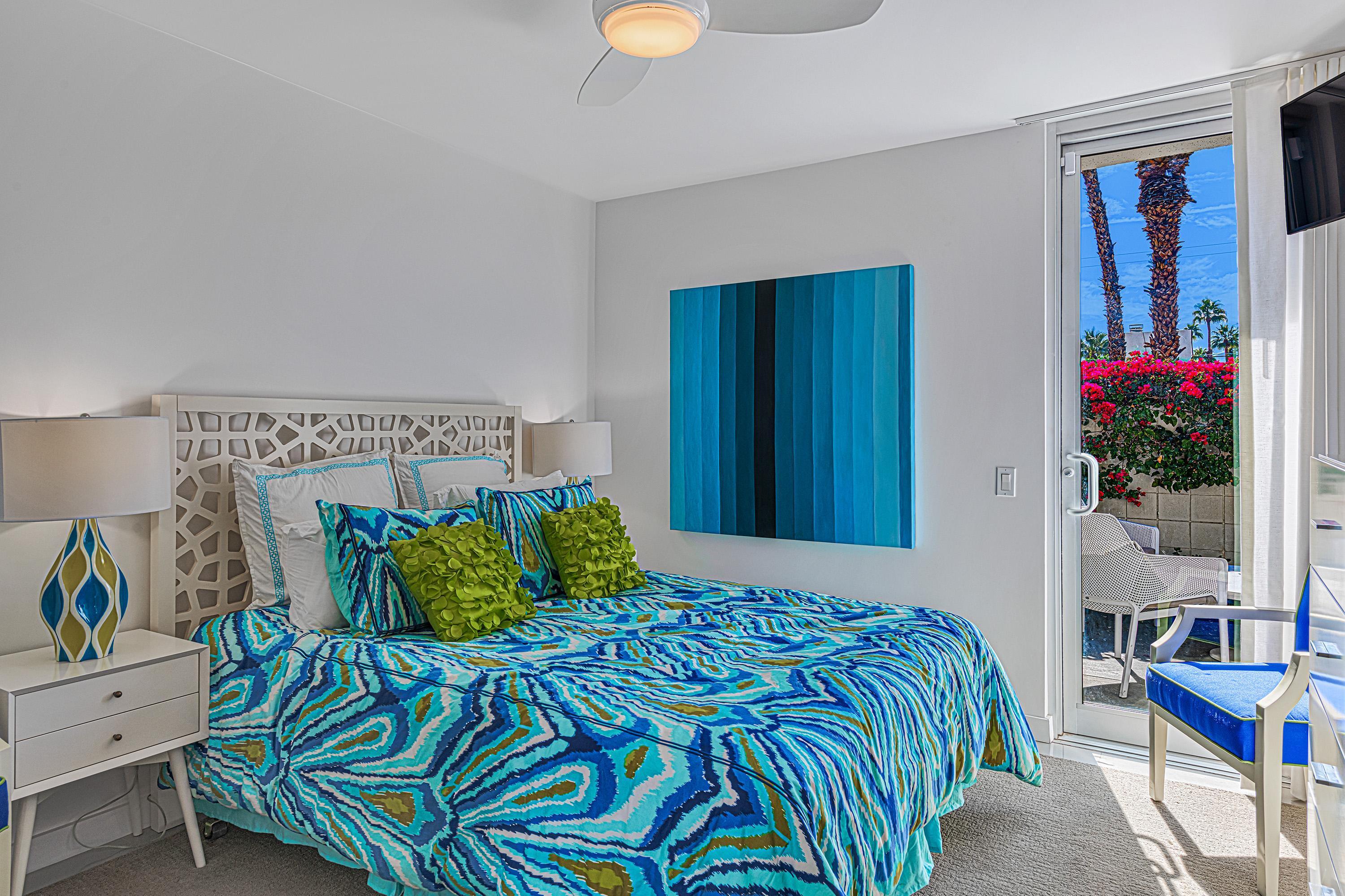 1130 East Deepwell Road Palm Springs, CA 92264 - Photo 28 of 55 a bedroom with a bed and a window