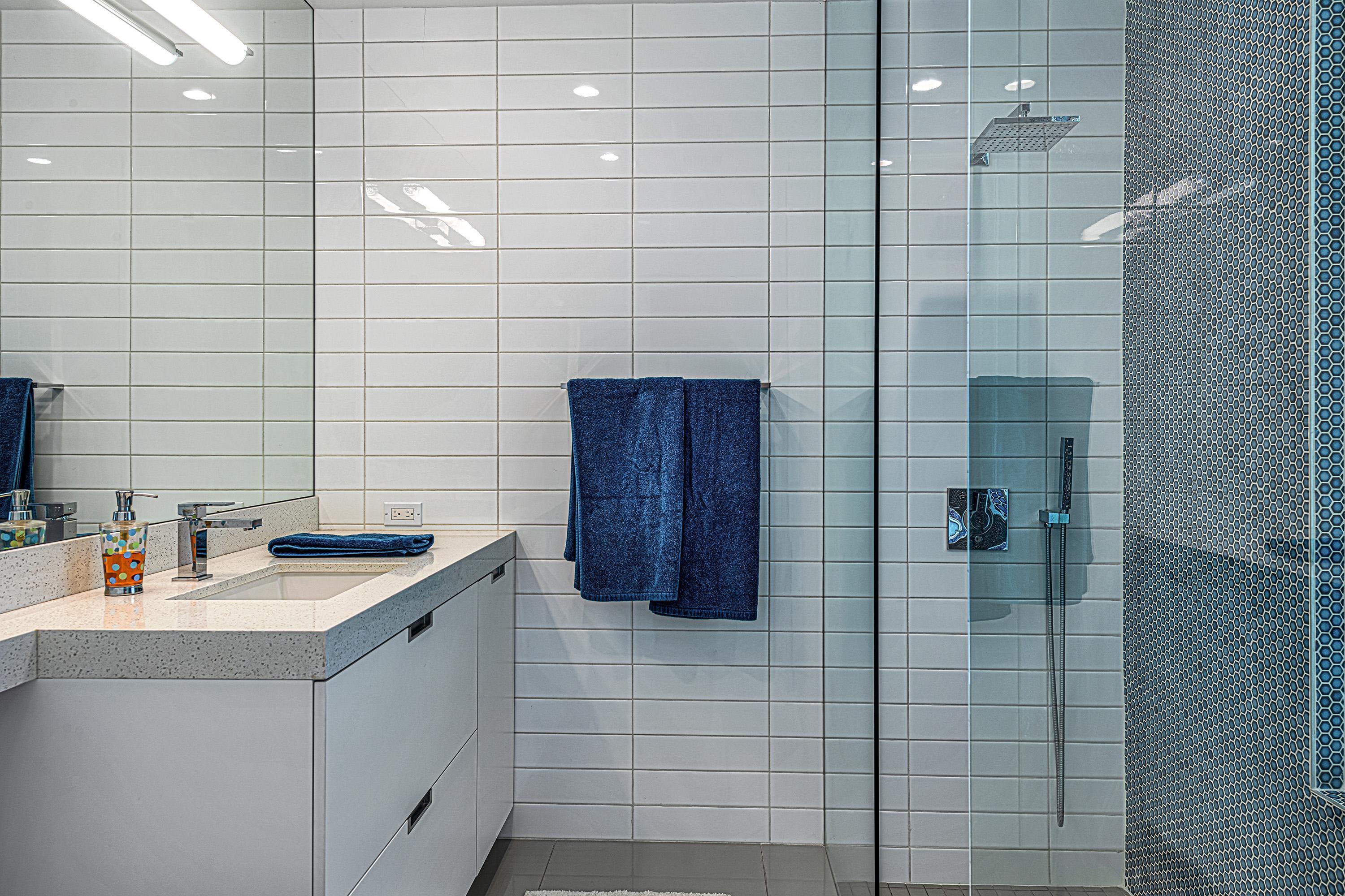 1130 East Deepwell Road Palm Springs, CA 92264 - Photo 29 of 55 a bathroom with a sink and a shower