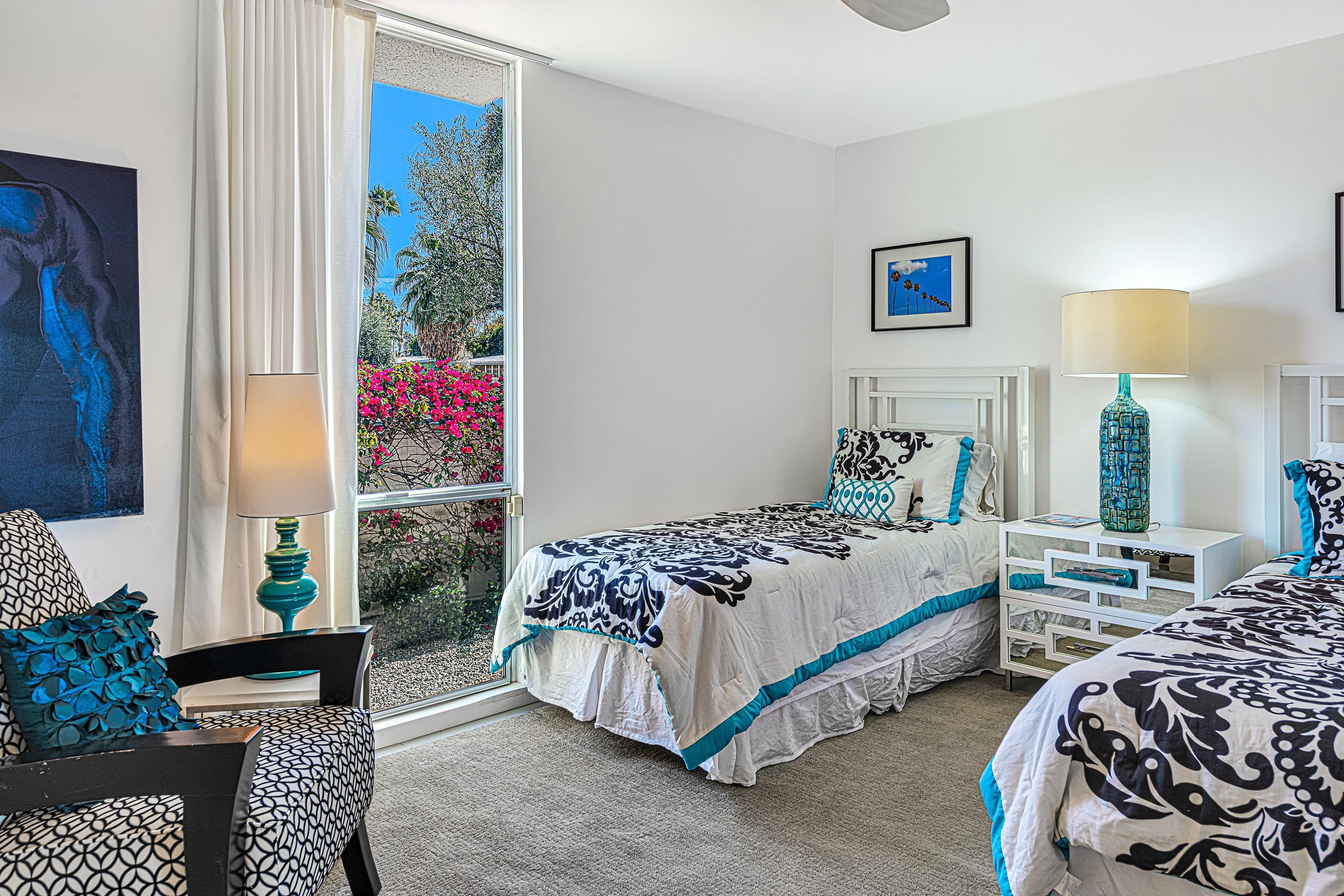 1130 East Deepwell Road Palm Springs, CA 92264 - Photo 30 of 55 a bedroom with bed and a window