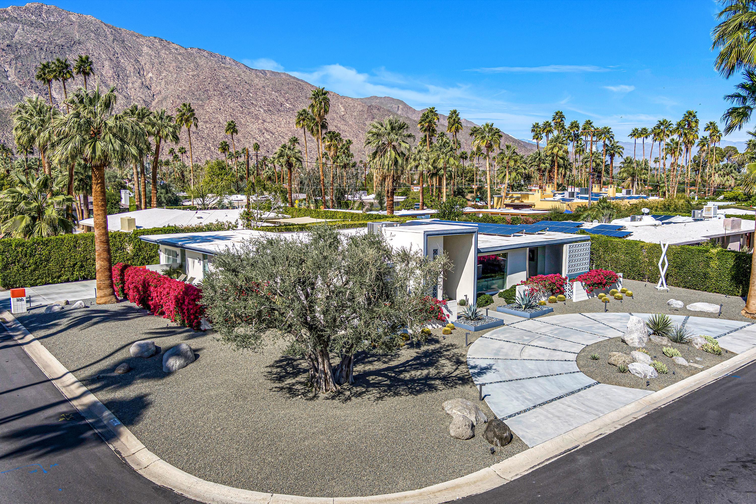 1130 East Deepwell Road Palm Springs, CA 92264 - Photo 36 of 55 a view of a swimming pool in a backyard