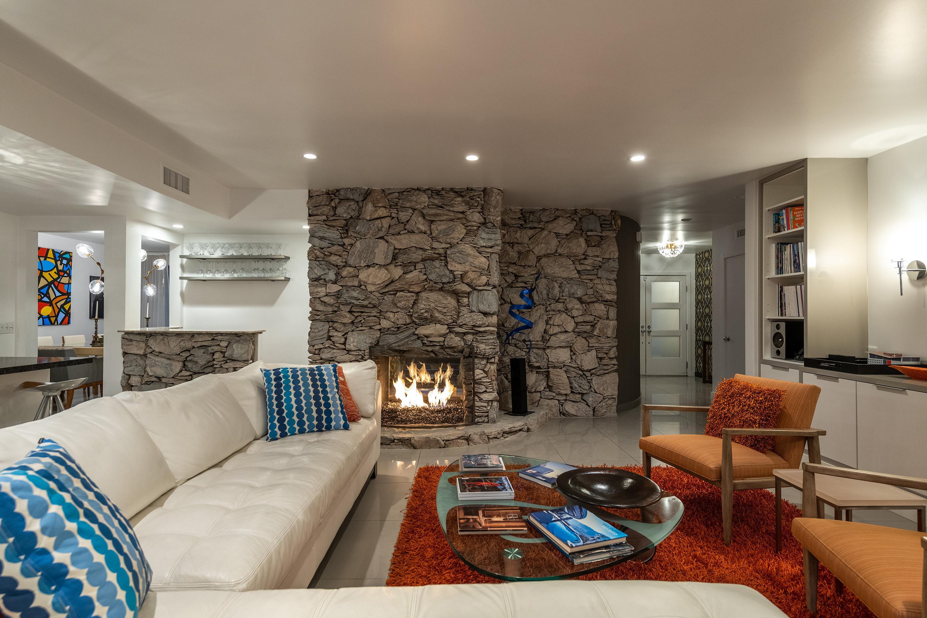 1130 East Deepwell Road Palm Springs, CA 92264 - Photo 42 of 55 a living room with furniture and a fireplace