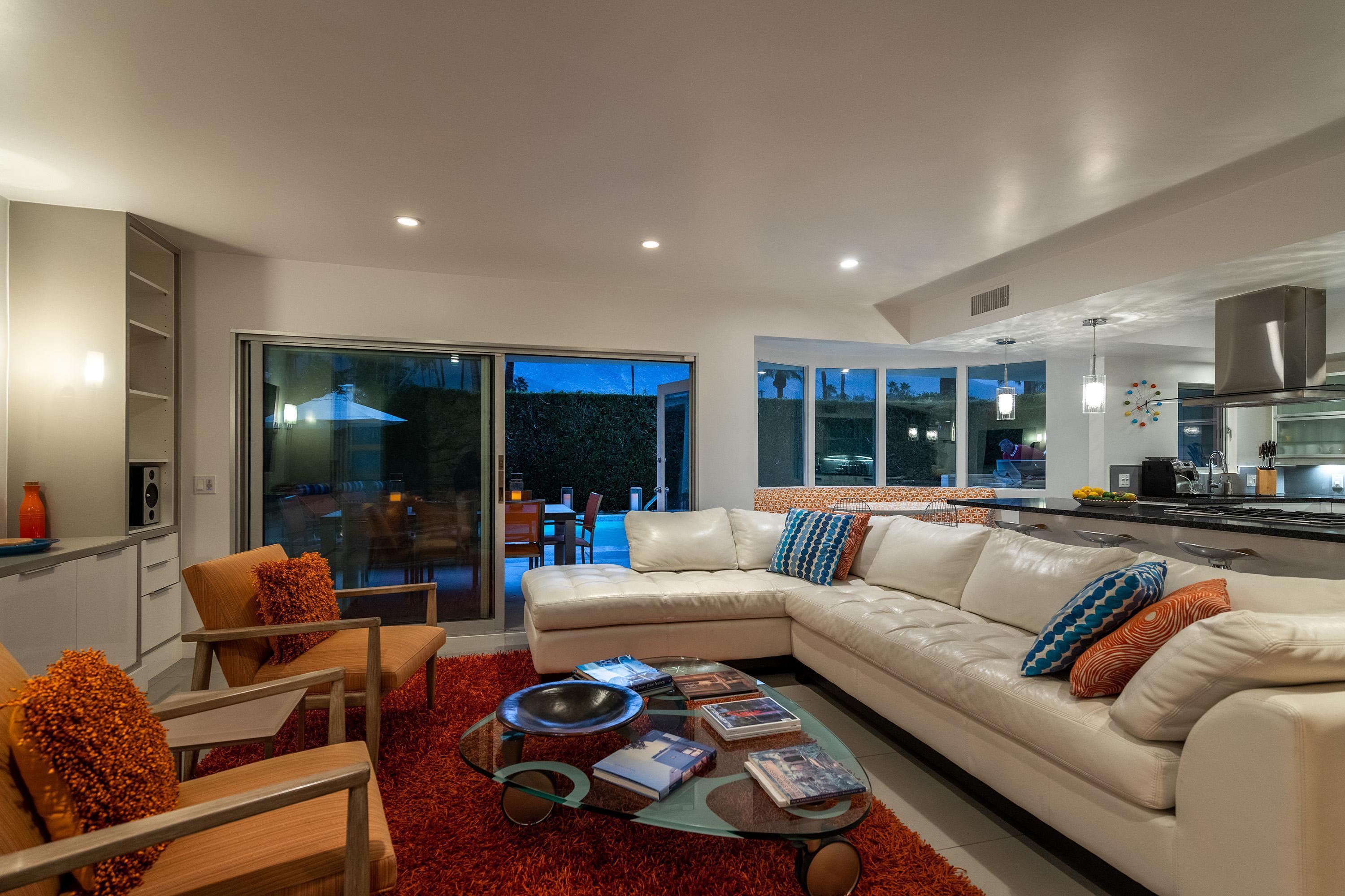 1130 East Deepwell Road Palm Springs, CA 92264 - Photo 43 of 55 a living room with furniture and a large window