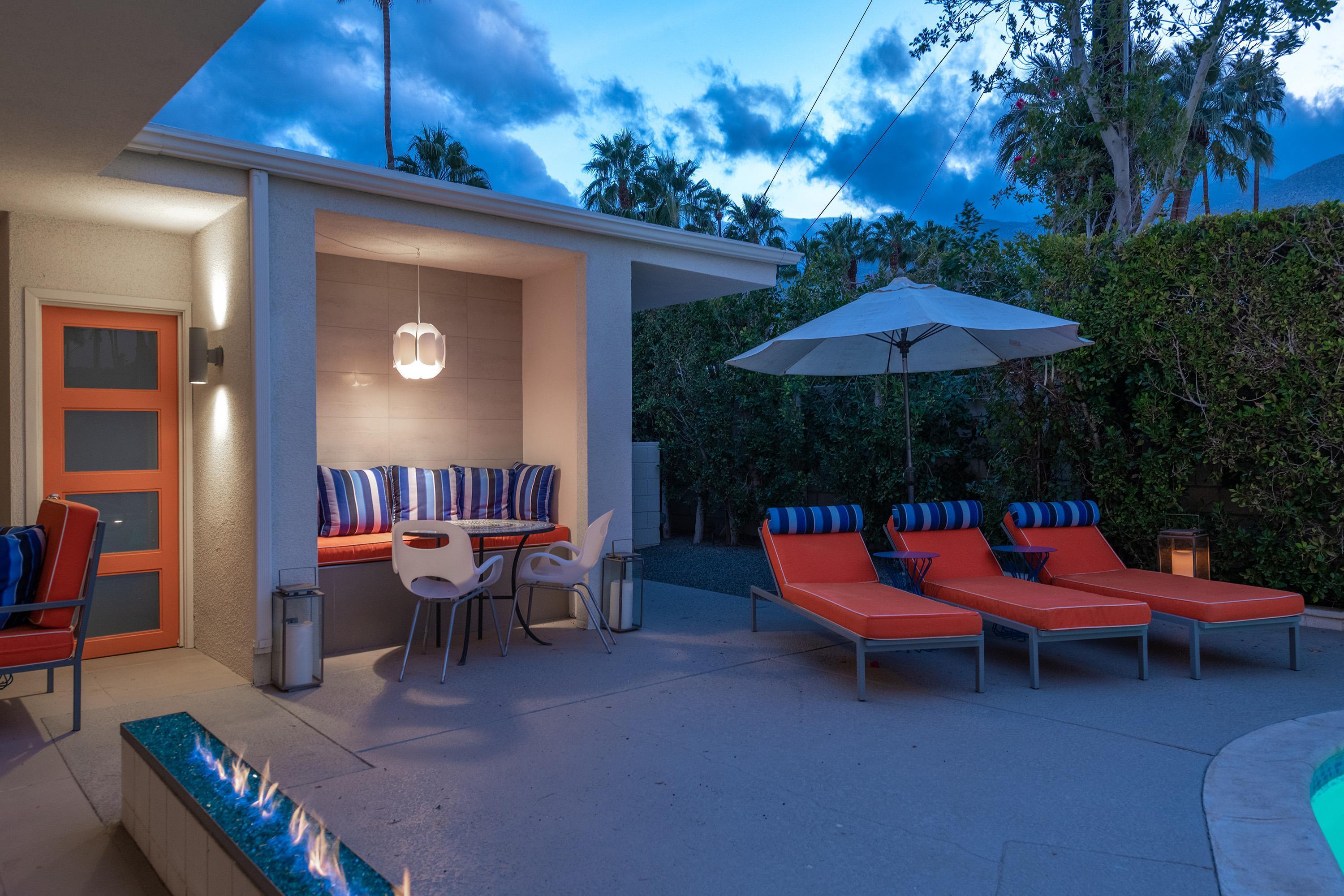 1130 East Deepwell Road Palm Springs, CA 92264 - Photo 46 of 55 a outdoor space with furniture and umbrella