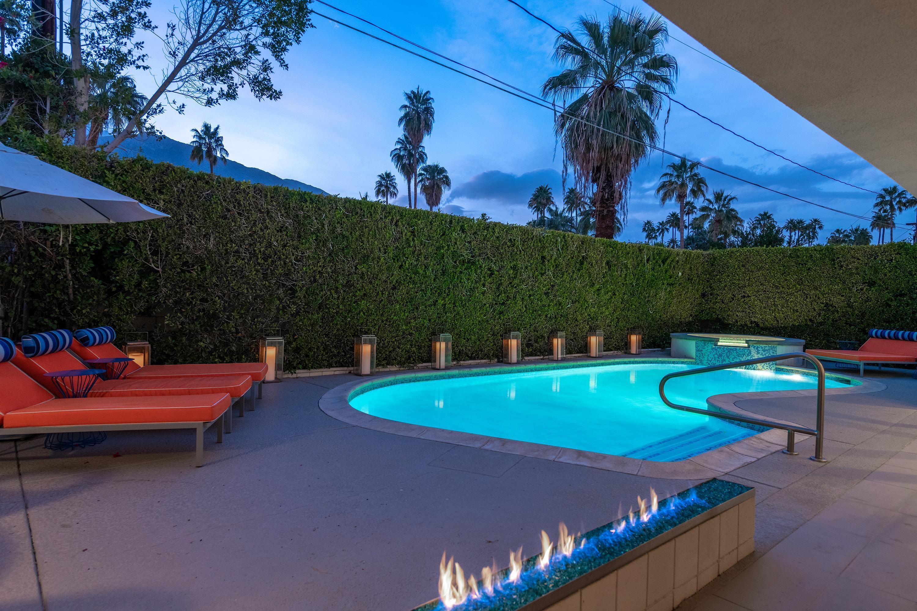 1130 East Deepwell Road Palm Springs, CA 92264 - Photo 48 of 55 an outdoor sitting area with a swimming pool