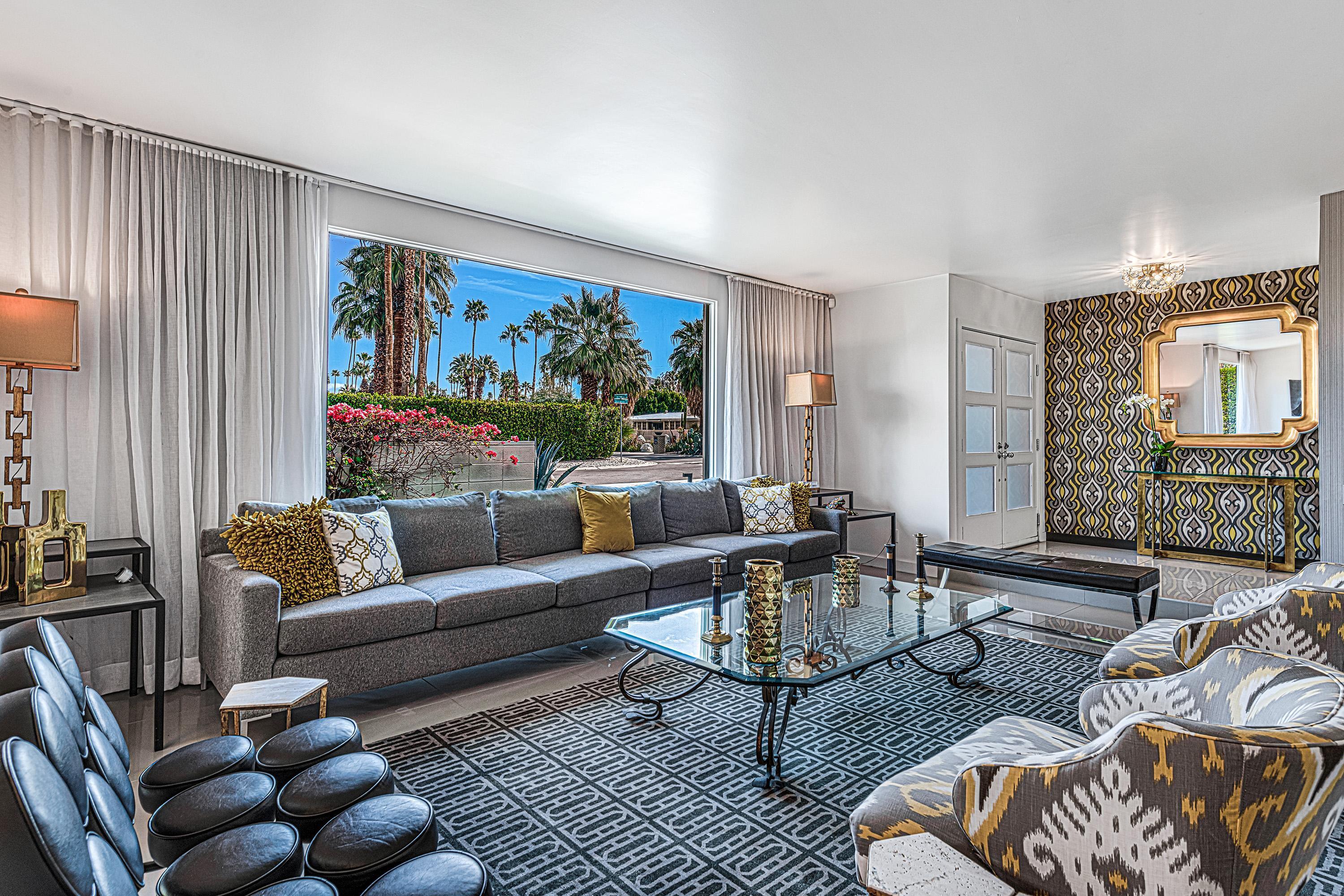 1130 East Deepwell Road Palm Springs, CA 92264 - Photo 6 of 55 a living room with furniture a rug and a large window